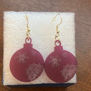 Purple snowflake round earrings.
